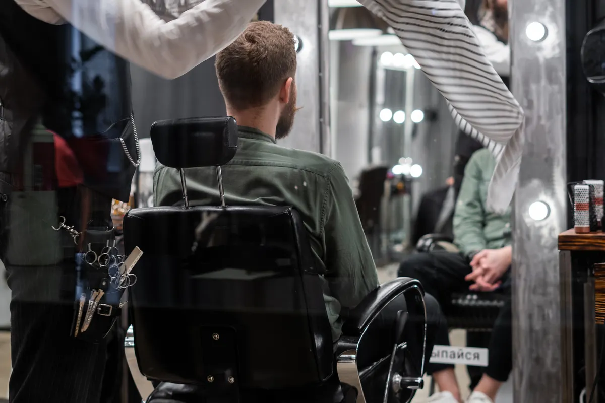 Modern textured men's haircut at barber